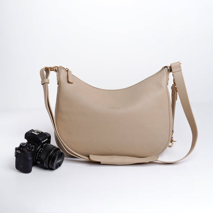 Front View of Beige VOYGR Essential Camera Bag with Canon Camera on Display