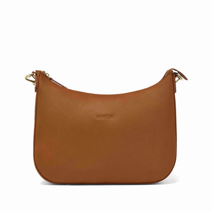 Brown camera bag with gold zipper on a white background